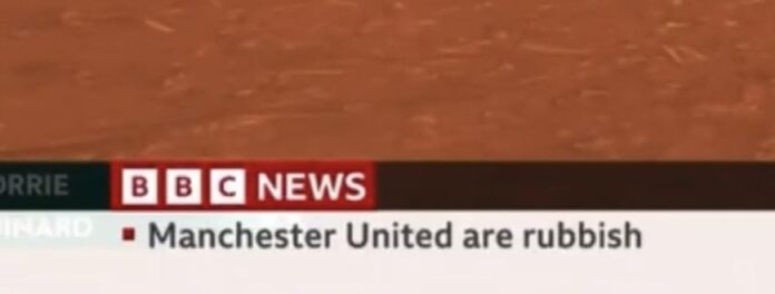 The BBC has issued an apology after a trainee displayed a news ticker briefly announced that Manchester United are rubbish