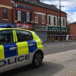 Police are questioning a man on suspicion of murder following a fatal stabbing in Oldham town centre in the early hours of the morning