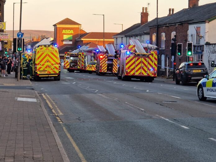 Three children have been reportedly rescued by the emergency services and rushed to hospital after a blaze at a derelict pub in Hazel Grove