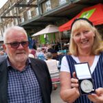 A Saddleworth artist who supported homelessness charity Emmaus Mossley for 18 years has received a special medal