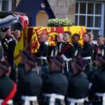 King Charles III is leading a procession behind the Queen’s coffin as it is taken from the Palace of Holyroodhouse to a nearby Cathedral